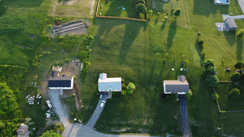 Aerial photo showing home and lot