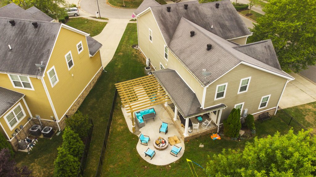 Drone image of a home showing a patio. 